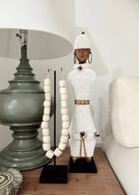 Load image into Gallery viewer, Kenyan Cream Carved Beads - on stand