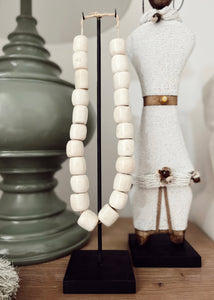 Kenyan Cream Carved Beads - on stand